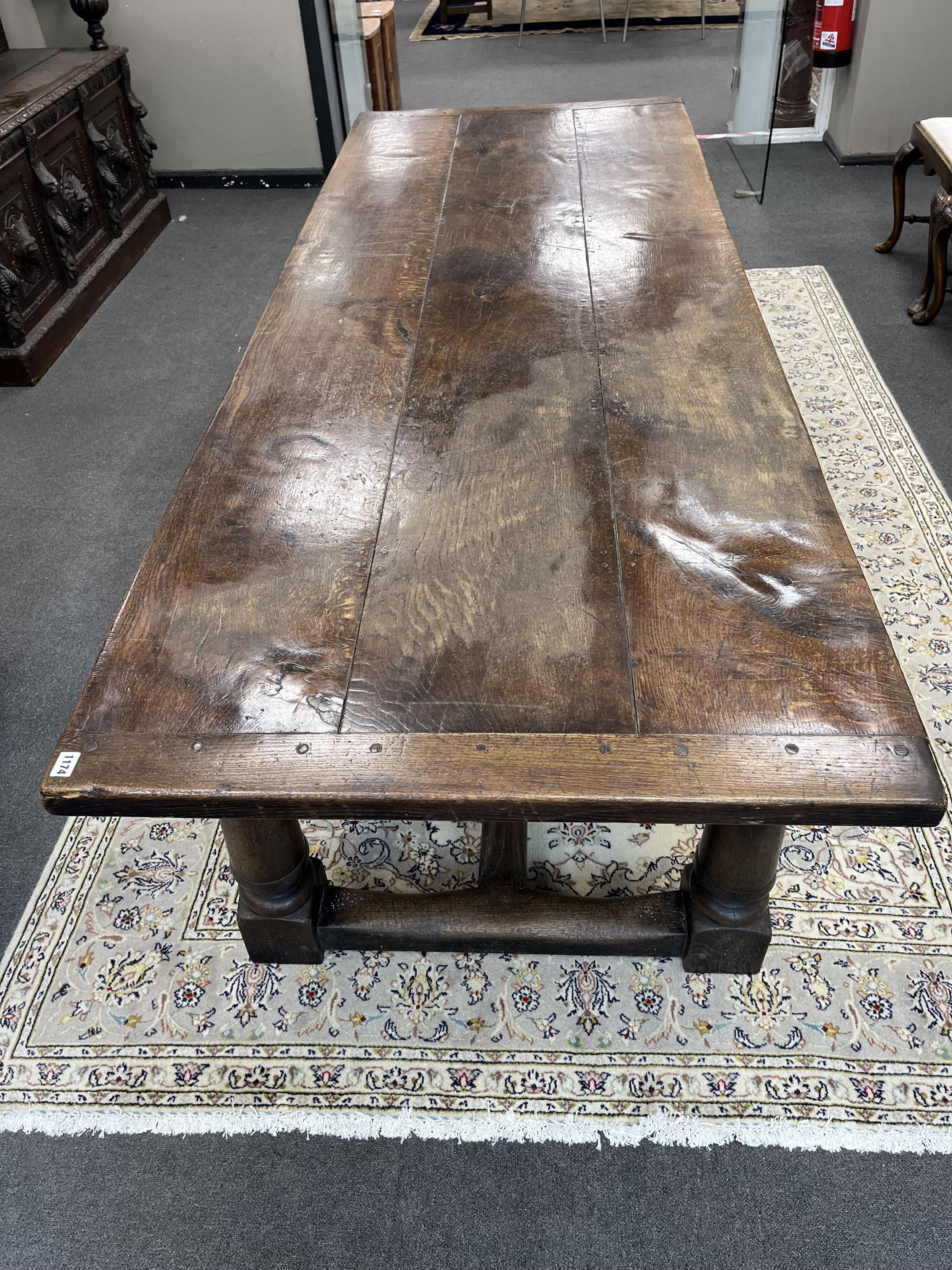 An 18th century style rectangular oak refectory dining table, width 243cm, depth 90cm, height 72cm. Condition - fair